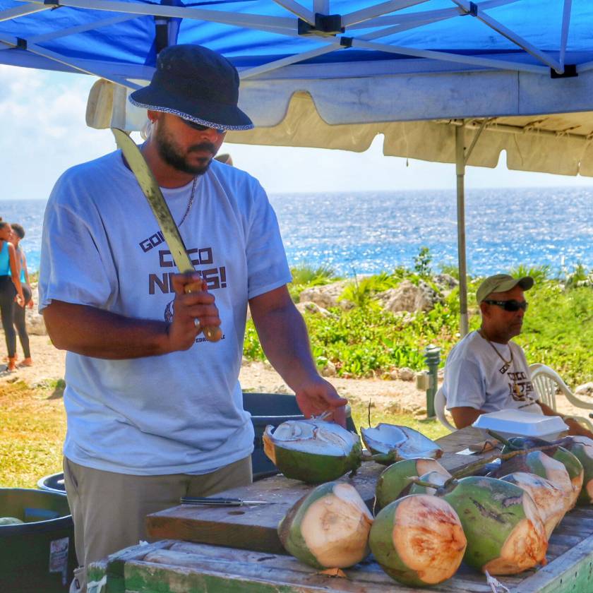 man at coconut stand